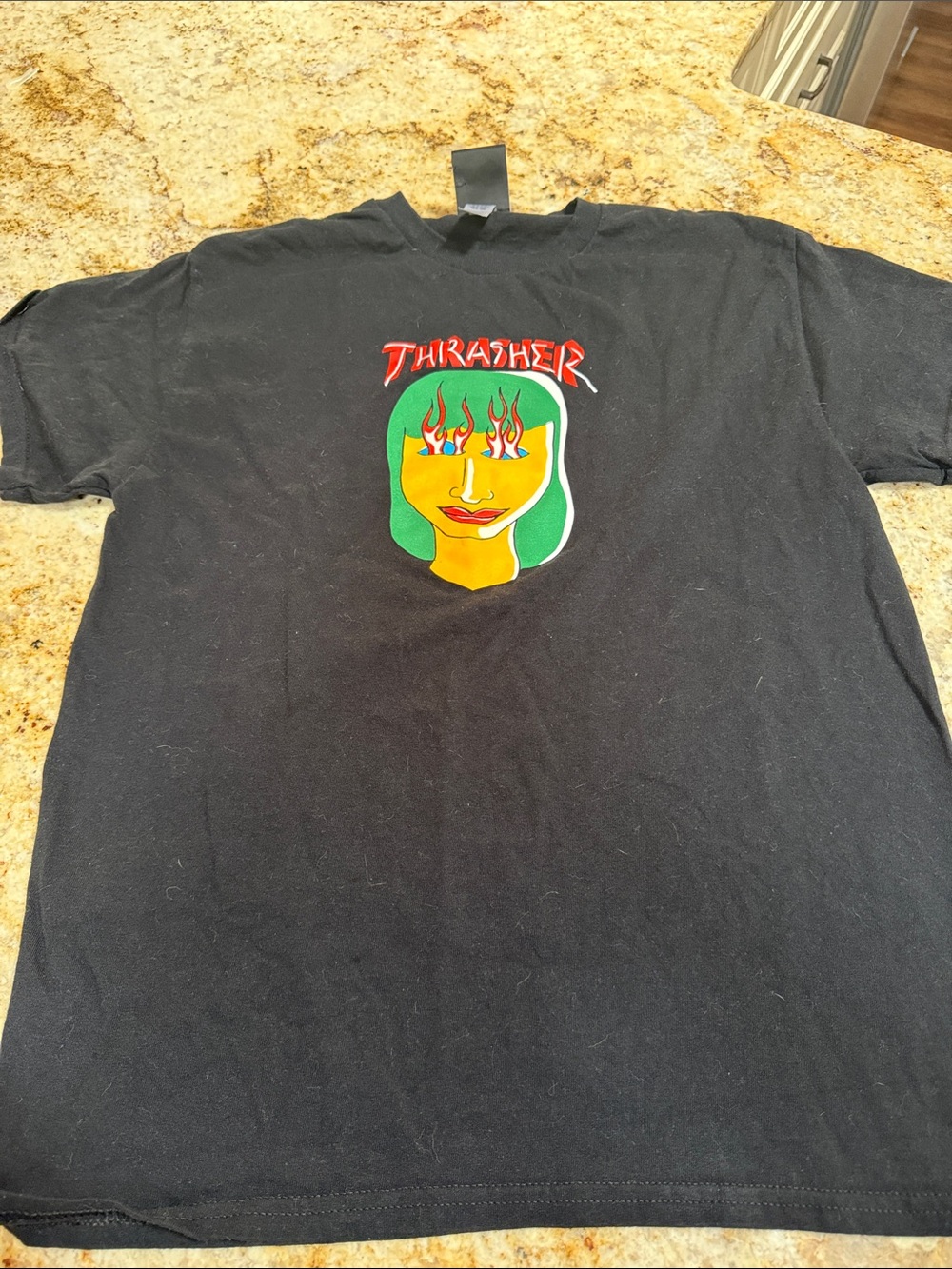 Thrasher Black Tee with Green-Haired Face and Red Logo